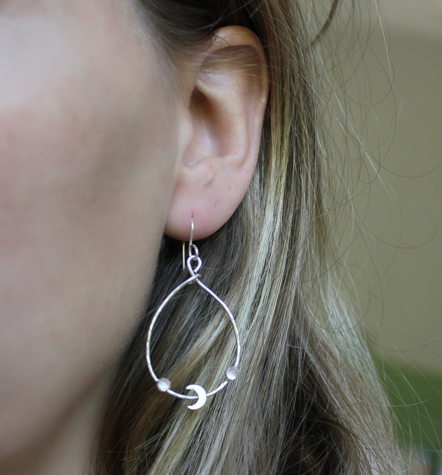 Silver crescent moon hoop earrings with moonstone